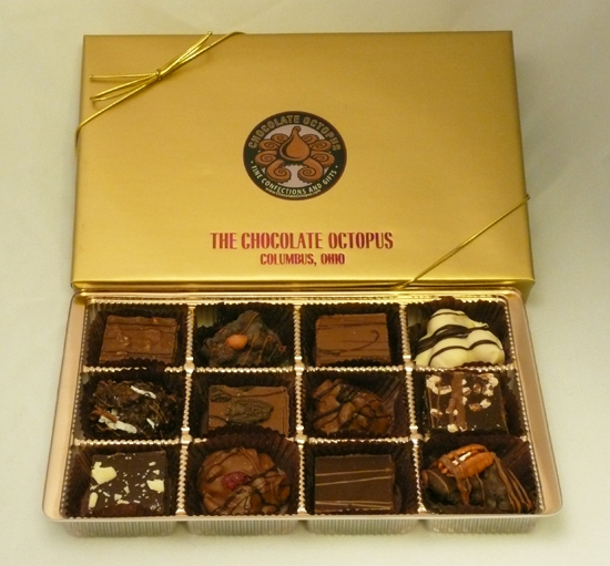 Signature Chocolates - Assortment | 12 Piece Box - An assortment of twelve of our best selling hand made Signature Chocolates in a deluxe signature gold box. Designer decorated and made fresh every day, this is a safe gift that will always be in good taste.	